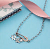 Pendente-LA-PETITE-STORY-acciaio-/-fiore-/-farfalla
