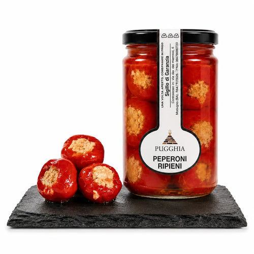 A jar of pugglia brand peperoni ripieni di tonno sottolio featuring vibrant red peppers filled with golden-brown tuna mix