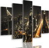 Quadro-Multipannello-Dubai-di-notte,-panorama-della-città