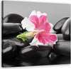 Quadro-su-tela,-Fiore-rosa-su-pietre-zen