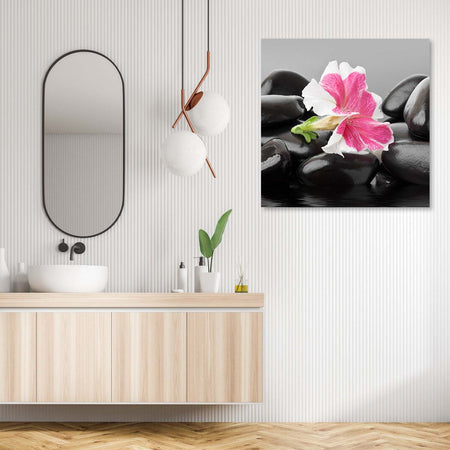 Quadro-su-tela,-Fiore-rosa-su-pietre-zen