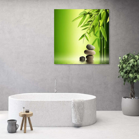 Quadro-su-tela,-Zen-e-pietre-di-bambù-su-uno-sfondo-verde