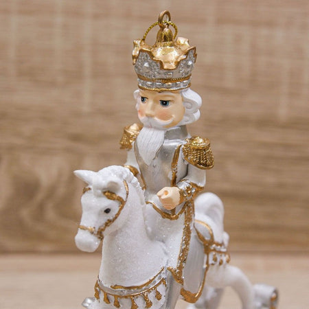 Statuetta Soldatino con cavallo a dondolo, in poliresina bianco e oro h 42 cm