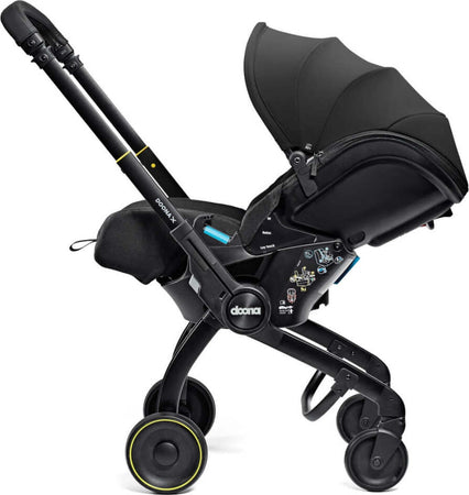 Seggiolino-Auto-e-Passeggino-Doona-X-I-size