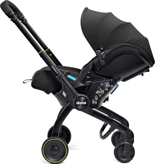 Seggiolino-Auto-e-Passeggino-Doona-X-I-size