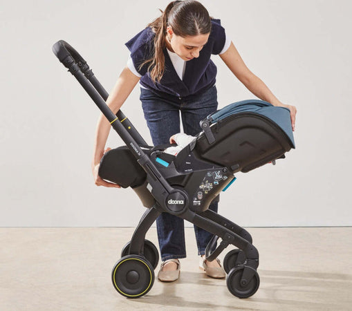 Seggiolino-Auto-e-Passeggino-Doona-X-I-size