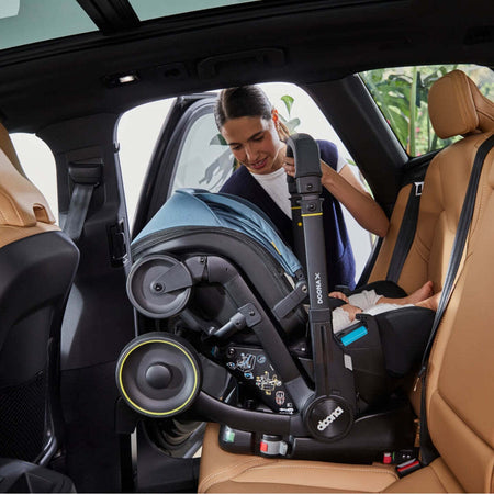 Seggiolino-Auto-e-Passeggino-Doona-X-I-size