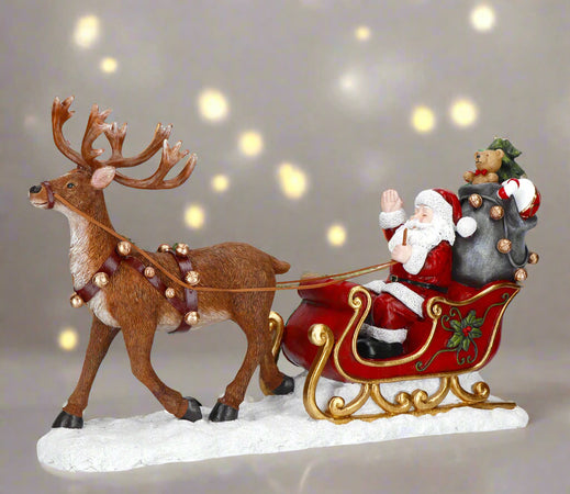 Statuetta-Babbo-Natale-su-slitta-con-alce-in-poliresina-per-decorazioni-natalizie