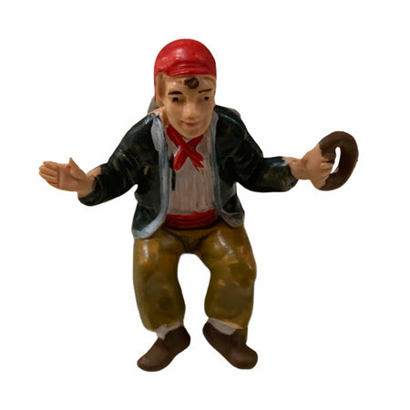 Statuetta per presepe natalizio uomo seduto con una ciambella h 7 cm