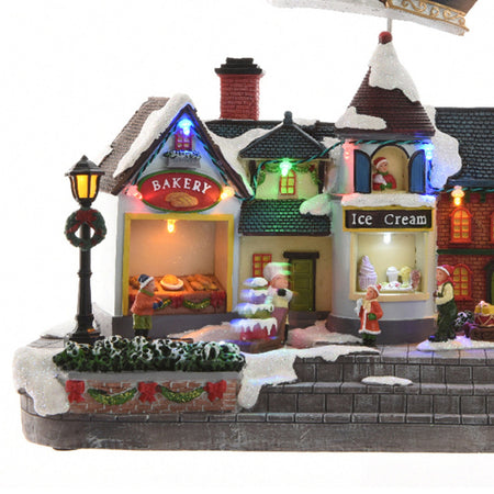 Scena animata a Led con negozi e babbo natale con renne con luci 27 cm