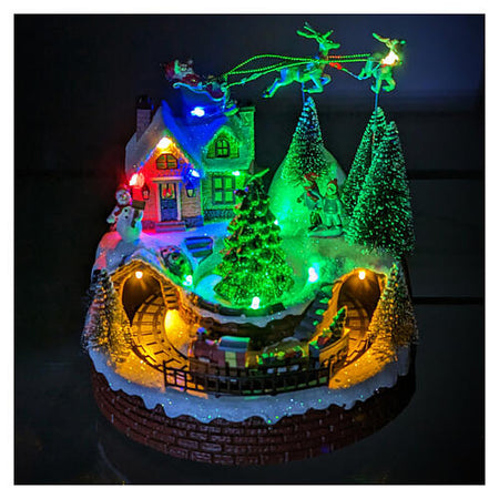 Scena animata per villaggio di Natale con personaggi con luci e movimento h 21 cm