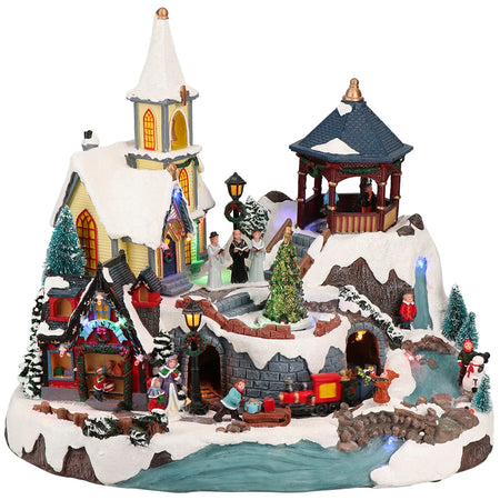 Villaggio natalizio illuminato con bambini con led multicolor decorazione per villaggio di Natale